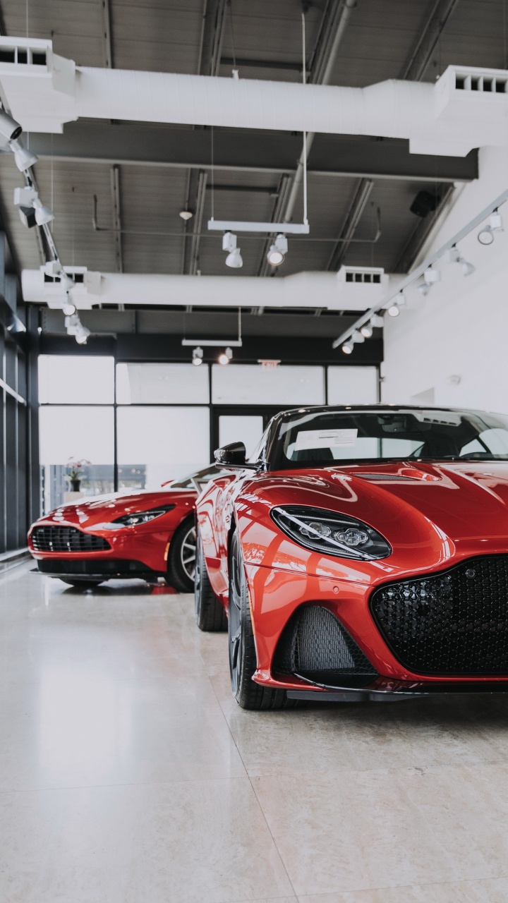 Обои гоночный автомобиль, легковые автомобили, колесо, шина, автомобильное освещение в разрешении 720x1280