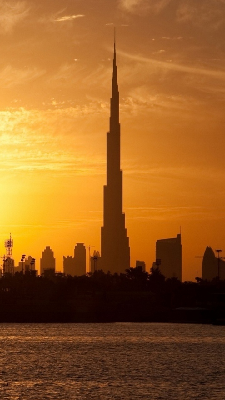 Обои Бурдж Халифа, город, линия горизонта, городской пейзаж, закат в разрешении 720x1280