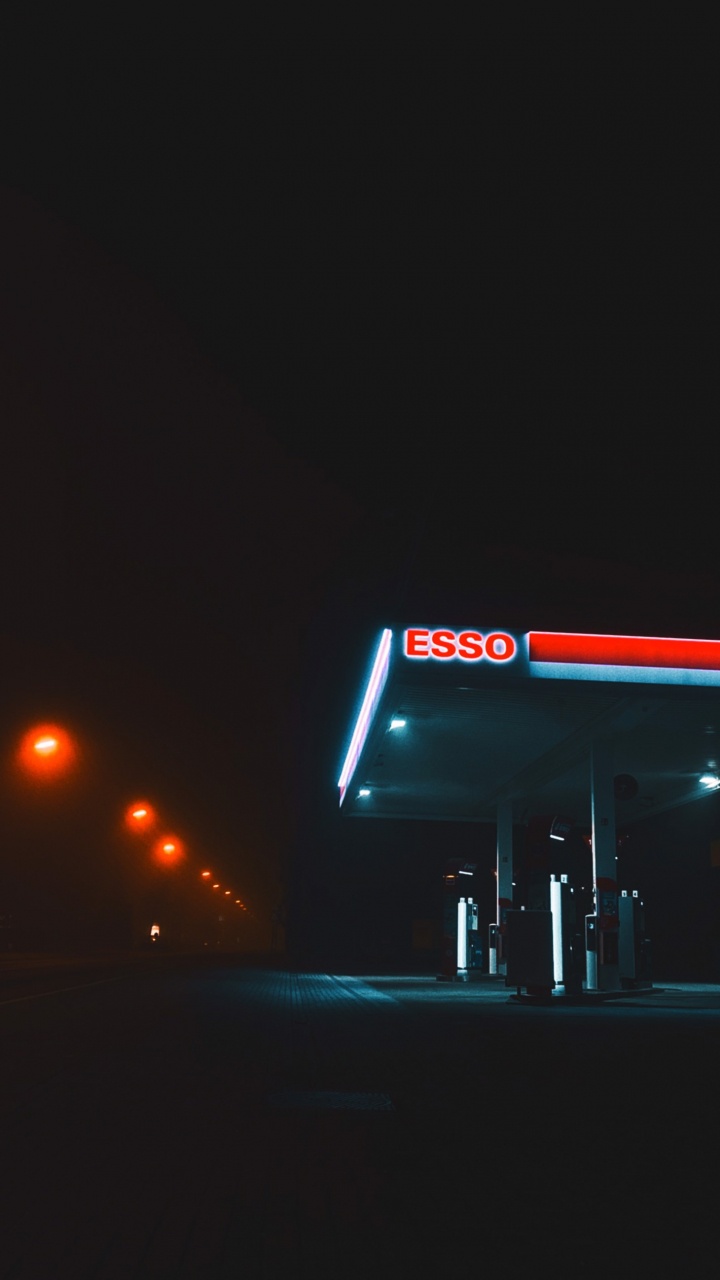 Обои ночь, Exxonmobil, корпорация Chevron, NYSE XOM, автомобильное освещение в разрешении 720x1280