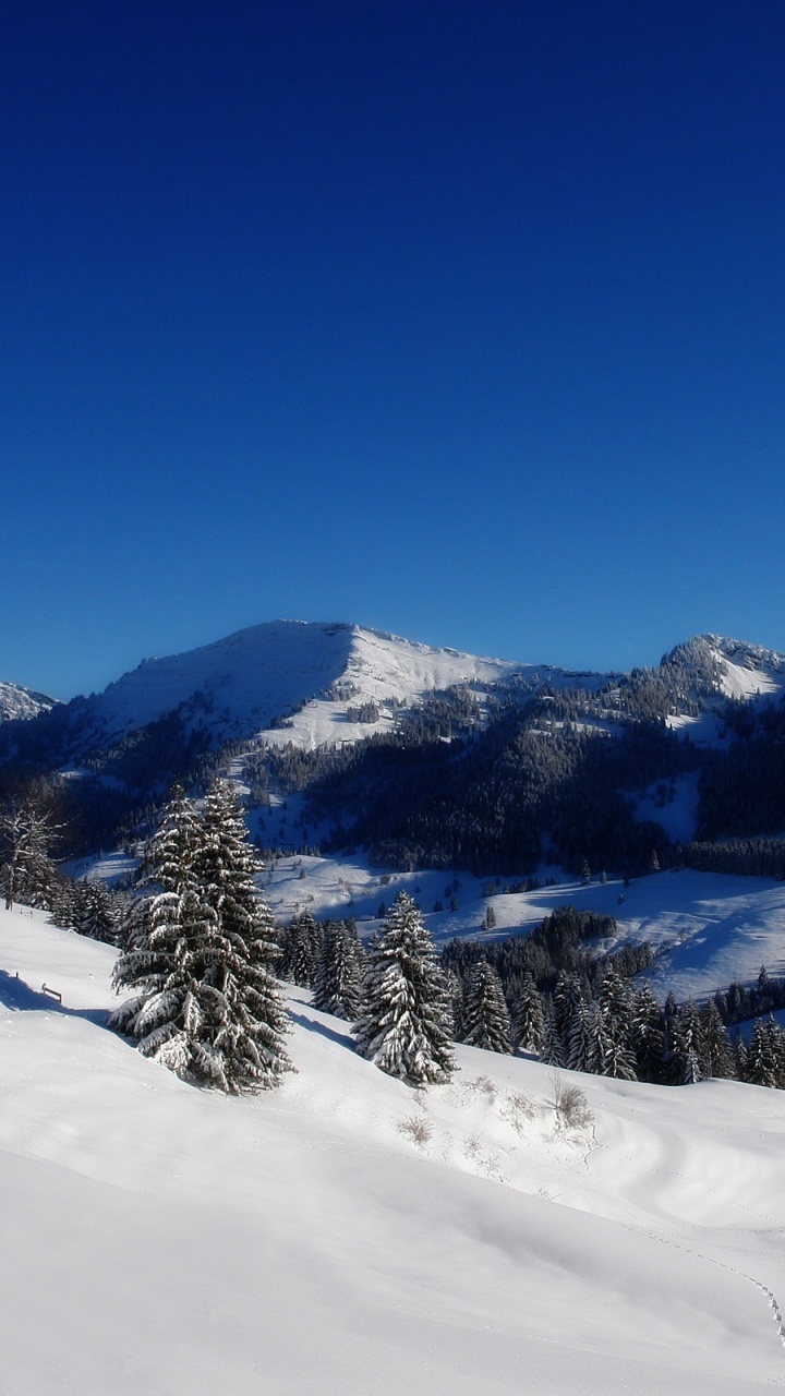 Обои зима, снег, гора, горный рельеф, горный хребет в разрешении 720x1280