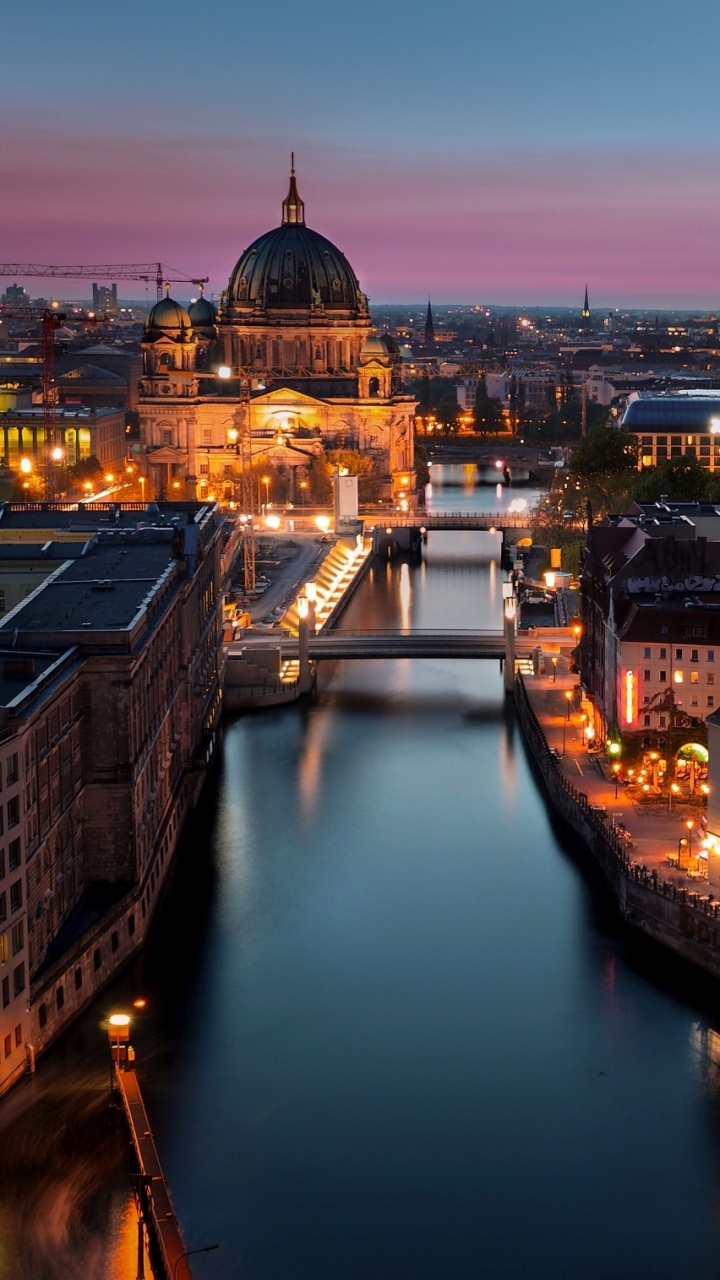 Обои город, освещение, городской пейзаж, ночь, городской район в разрешении 720x1280