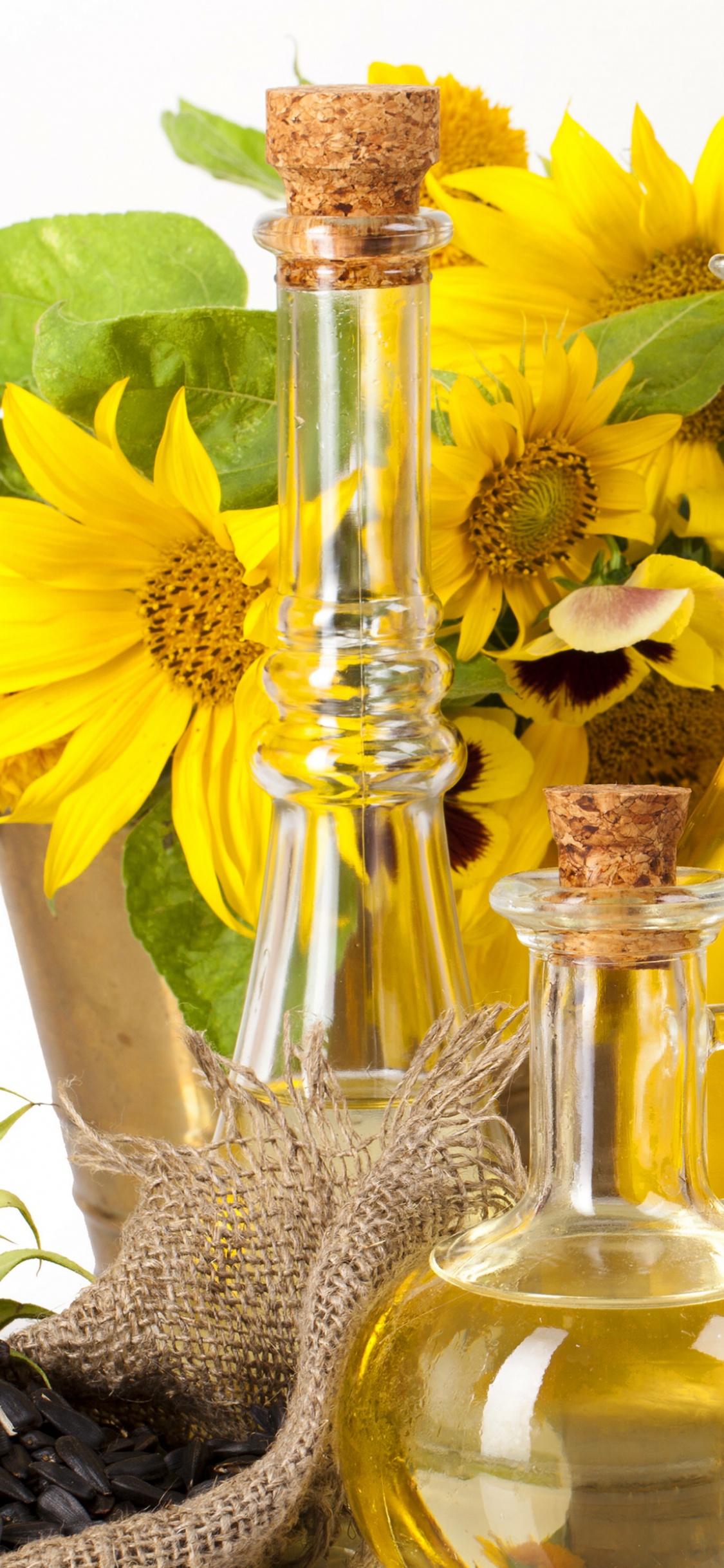 Обои подсолнечное масло, масло виноградной косточки, подсолнечник, кунжутное масло, семя подсолнечника в разрешении 1125x2436