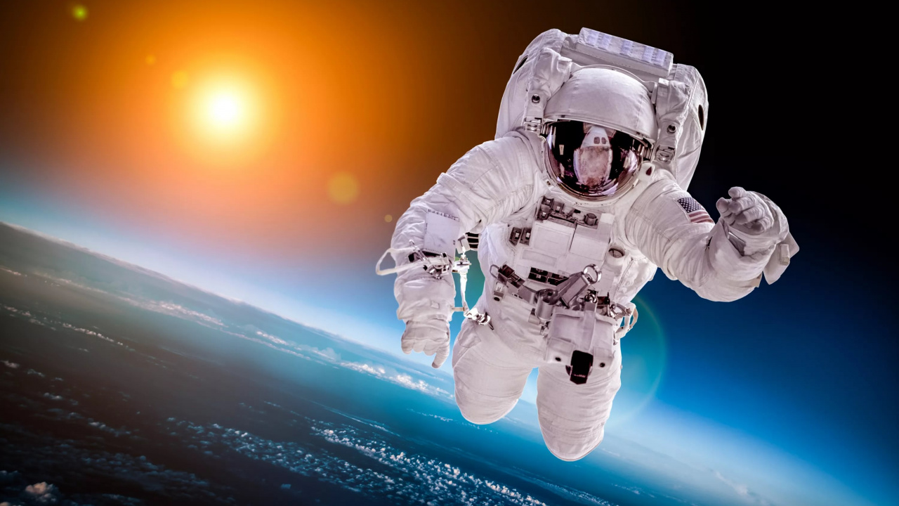 Обои астронавт в космосе, земля, астронавт, космическое пространство, космос в разрешении 1280x720