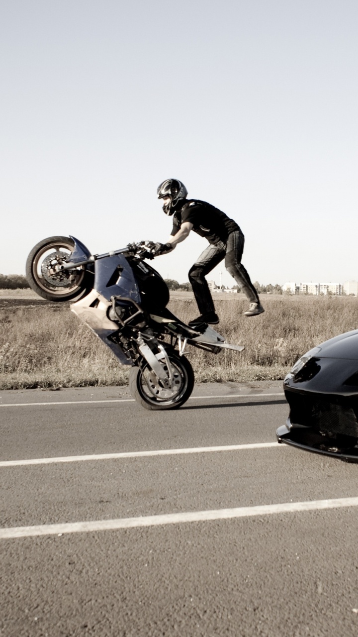 Обои мотоцикл стантрайдинга, мотоцикл, трюк, авто, колесо в разрешении 720x1280
