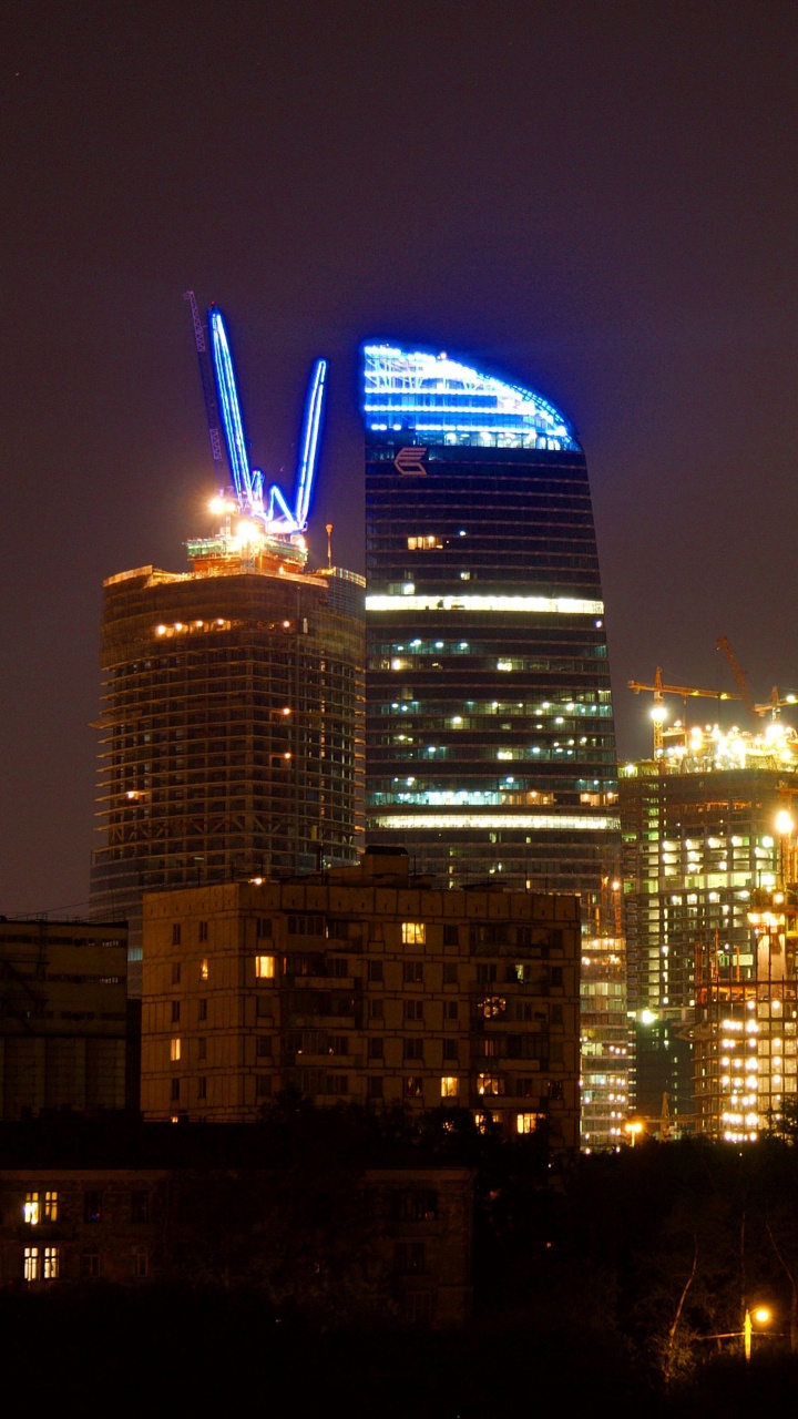 Обои город, городской пейзаж, метрополия, ночь, городской район в разрешении 720x1280