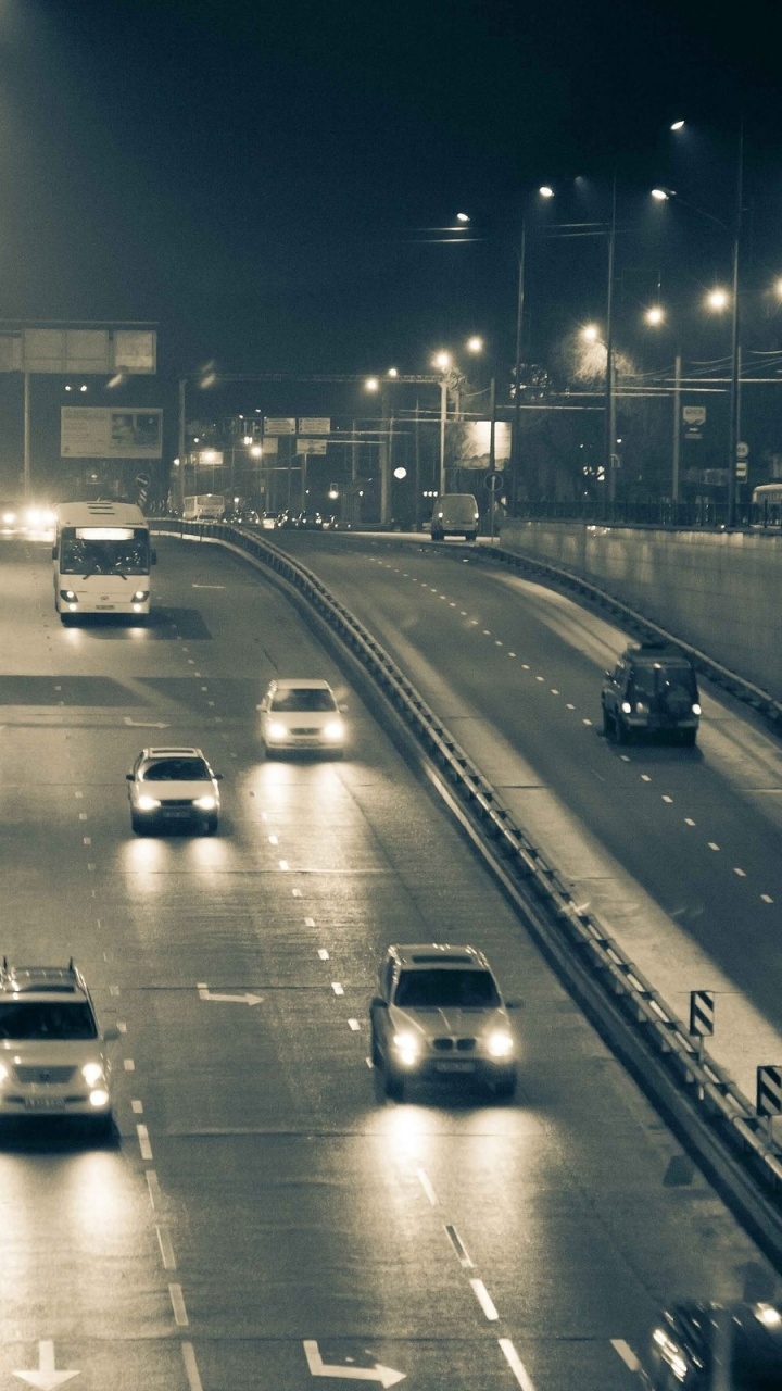 Обои дорога, переулок, ночь, магистраль, городской район в разрешении 720x1280