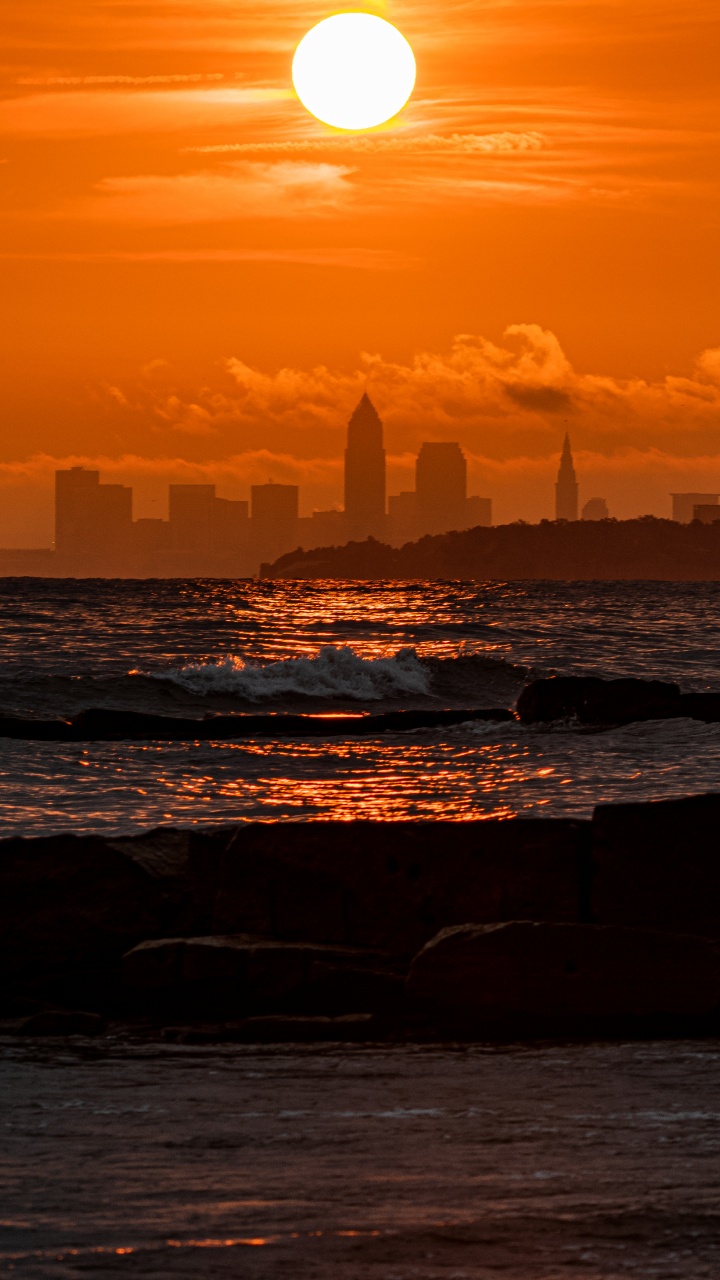 Обои закат, горизонт, послесвечение, море, восход солнца в разрешении 720x1280