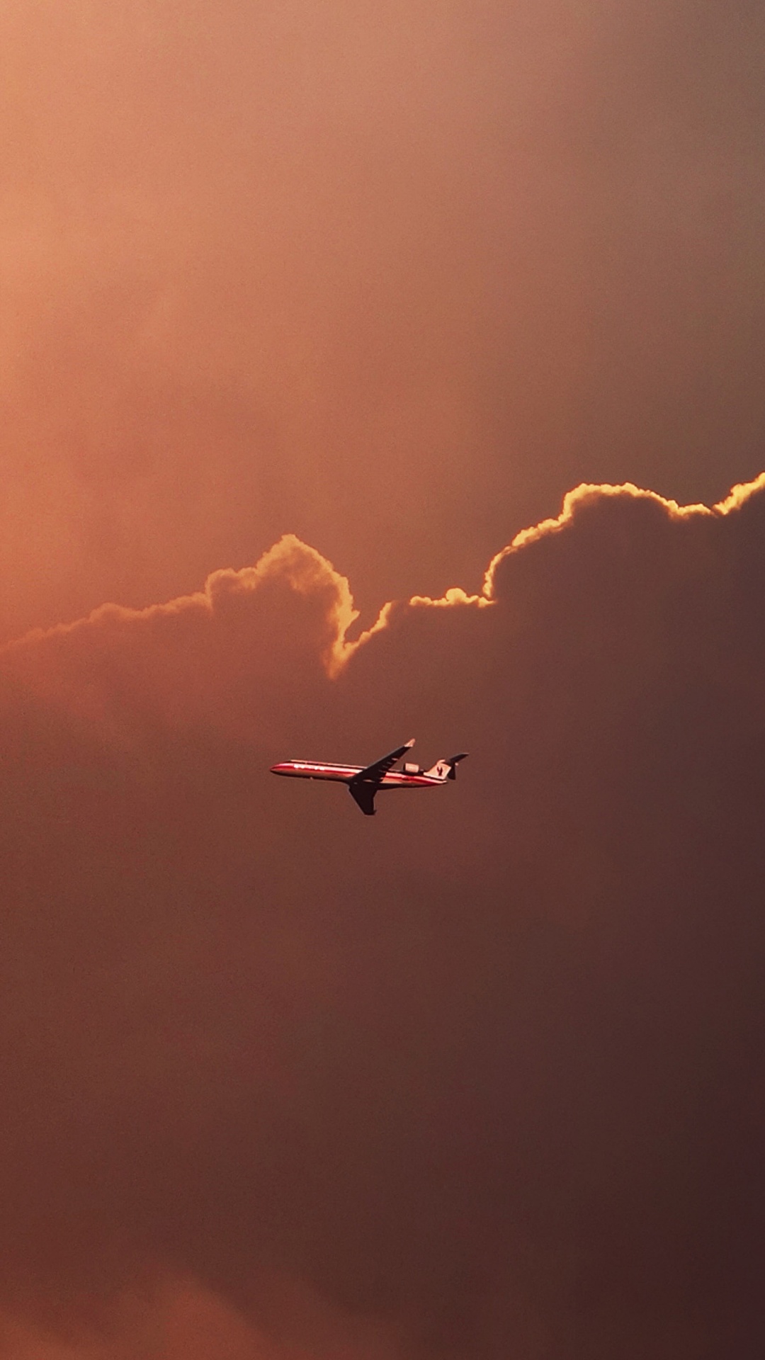 Обои самолет, атмосфера, облако, вечер, солнечный свет в разрешении 1080x1920