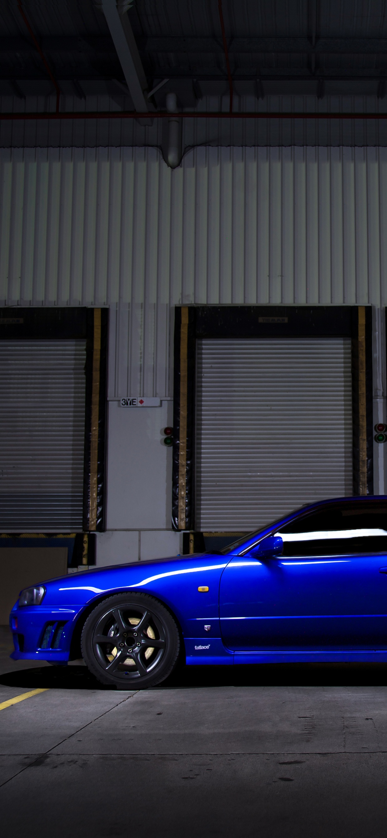 Обои nissan skyline, спорткар, Ниссан, колесо, авто в разрешении 1242x2688