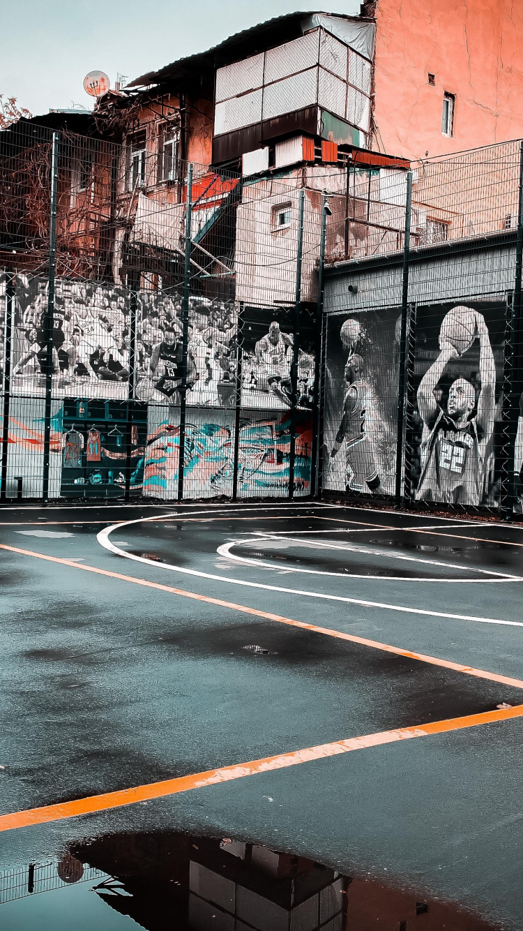 Обои легковые автомобили, яблоко, красочность, здание, дорожное покрытие в разрешении 750x1334