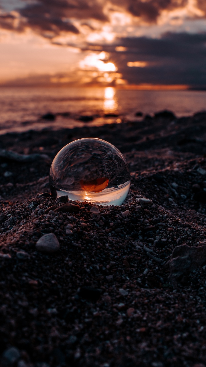 Обои вода, отражение, рок, небо, огонь в разрешении 720x1280