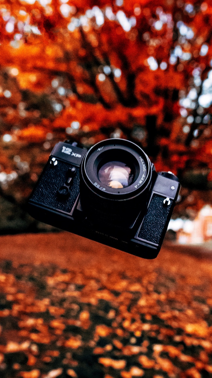 Обои крупный план, цифровой фотоаппарат, камера, зеркальная камера, объектив камеры в разрешении 720x1280