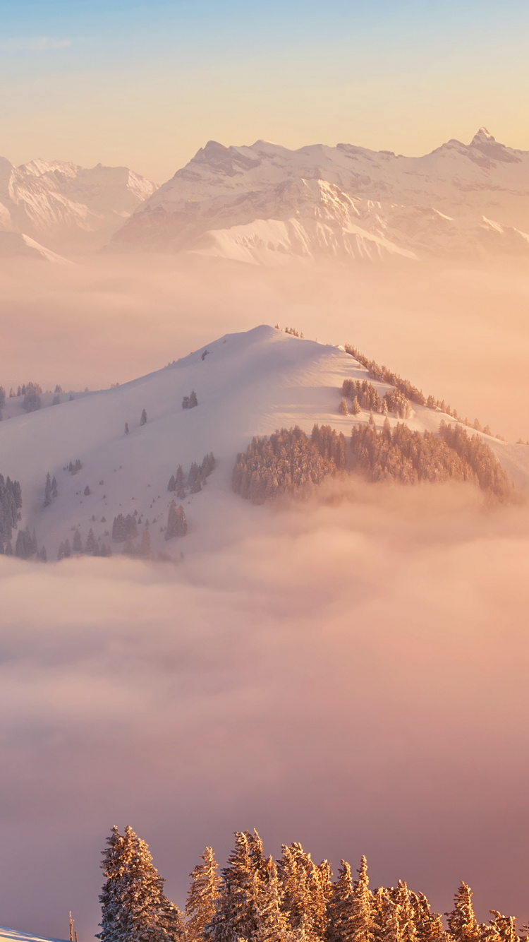 Обои гора, море облаков, горный хребет, горный рельеф, зима в разрешении 750x1334