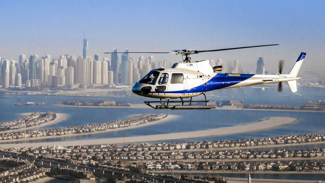 Обои HeliDubai, полет, вертолет, винтокрыл, город в разрешении 1280x720