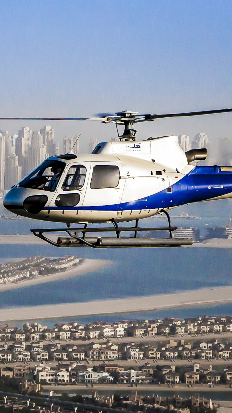 Обои HeliDubai, полет, вертолет, винтокрыл, город в разрешении 750x1334