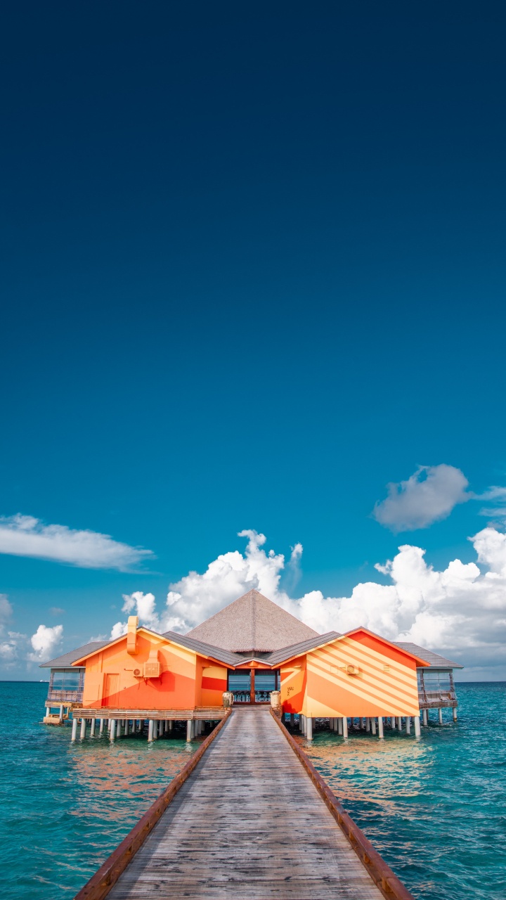 Обои море, здание, синий, океан, бирюза в разрешении 720x1280