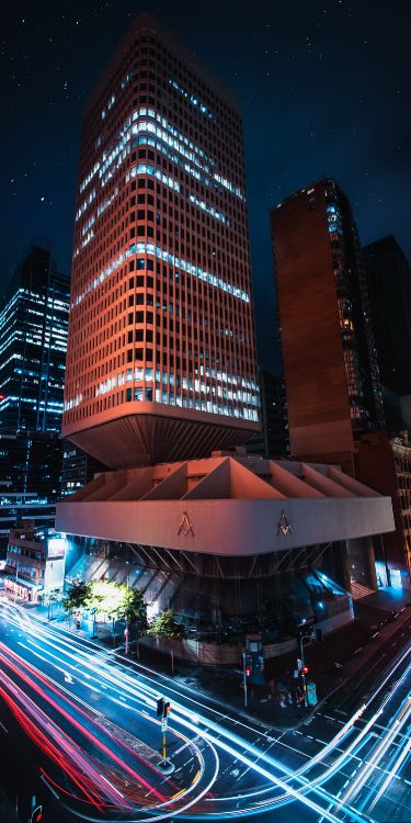 Обои яблоко, небоскреб, здание, дневное время, свет в разрешении 1500x3000